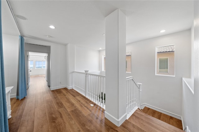 hallway with wood-type flooring