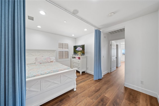 bedroom featuring dark hardwood / wood-style floors