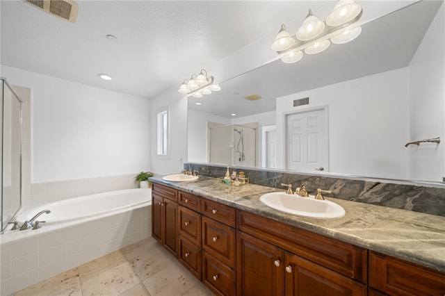 bathroom featuring separate shower and tub and vanity