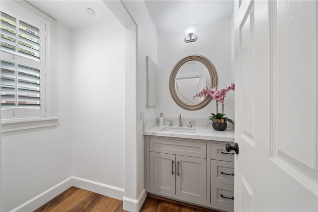 bathroom featuring hardwood / wood-style floors and vanity