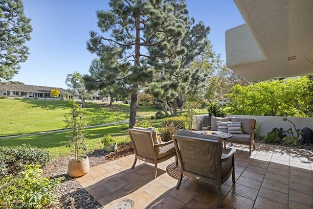 view of patio / terrace with a fire pit