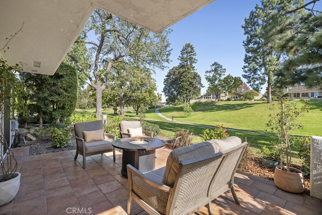 view of patio featuring an outdoor fire pit