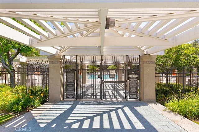 view of gate featuring a pergola