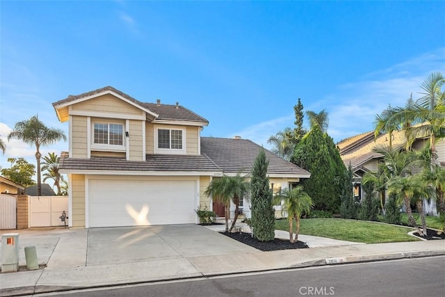 view of front facade featuring a garage and a front yard