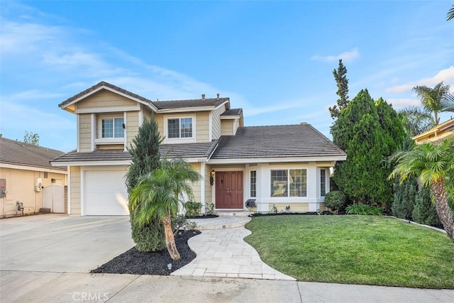 view of front of home featuring a garage and a front yard