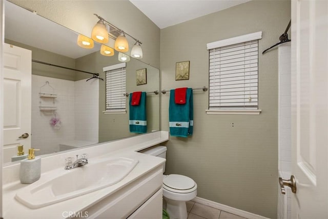 bathroom with tile patterned floors, vanity, and toilet