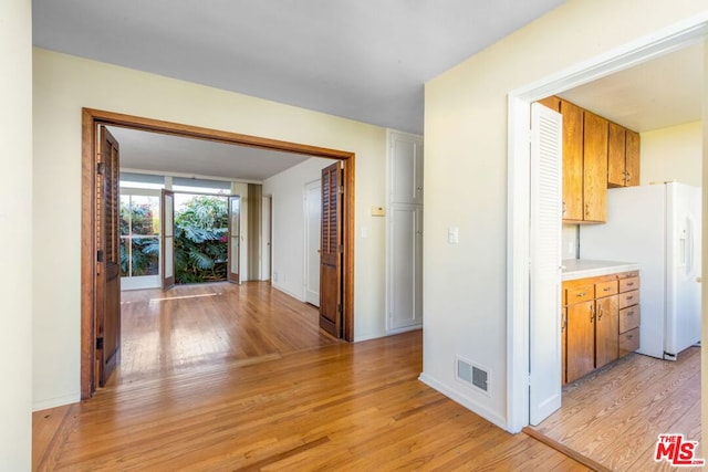 hallway featuring light hardwood / wood-style flooring