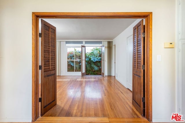 hallway with light wood-type flooring