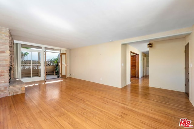 unfurnished living room with light wood-type flooring