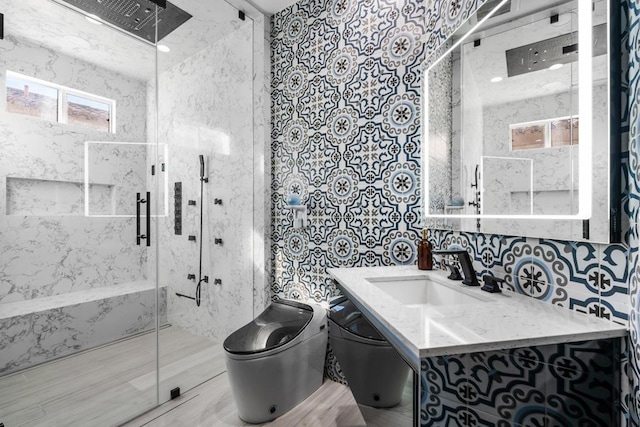 bathroom with vanity, an enclosed shower, tile walls, and toilet