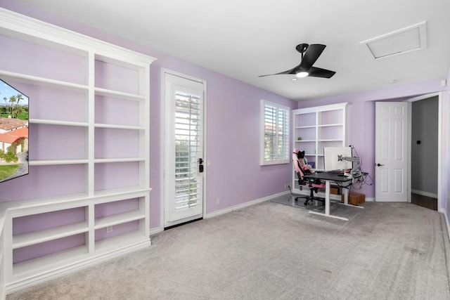 carpeted office featuring ceiling fan