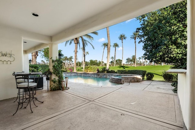 view of swimming pool featuring a patio area, an in ground hot tub, and a yard