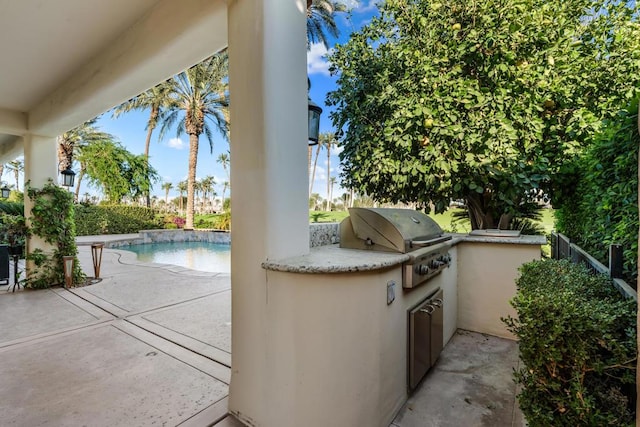 view of patio / terrace with a fenced in pool, area for grilling, and a grill