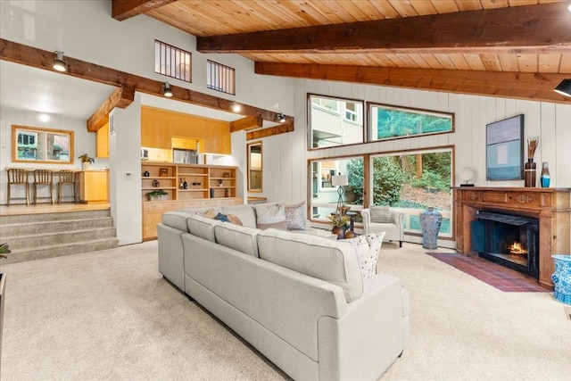 living room with beamed ceiling, high vaulted ceiling, wooden ceiling, and carpet flooring