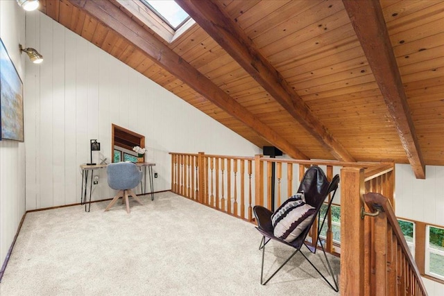 carpeted office featuring wooden walls, lofted ceiling with skylight, and wooden ceiling