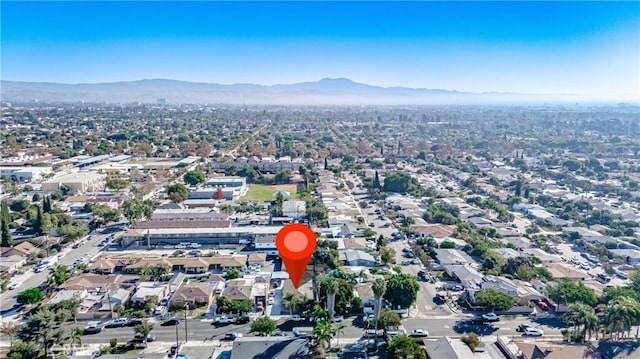 birds eye view of property with a mountain view