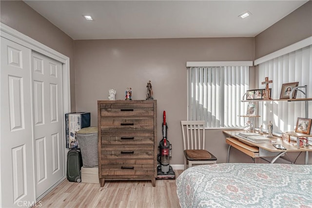 bedroom with a closet and light wood-type flooring