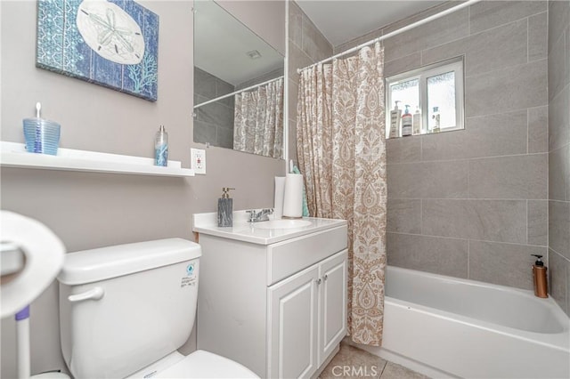 full bathroom featuring tile patterned floors, shower / tub combo with curtain, vanity, and toilet