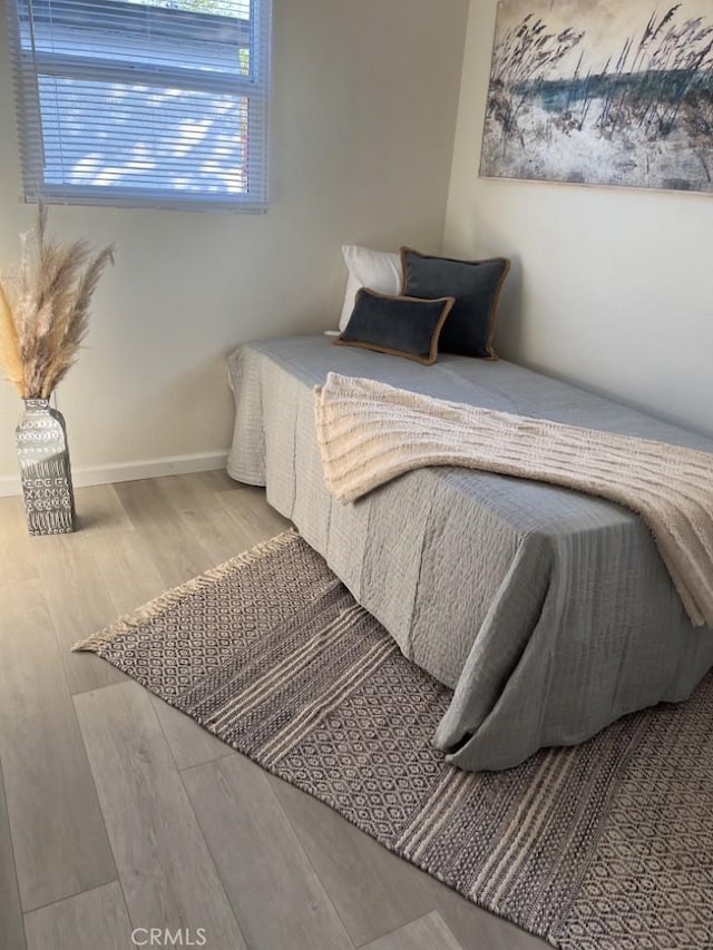 bedroom with wood-type flooring