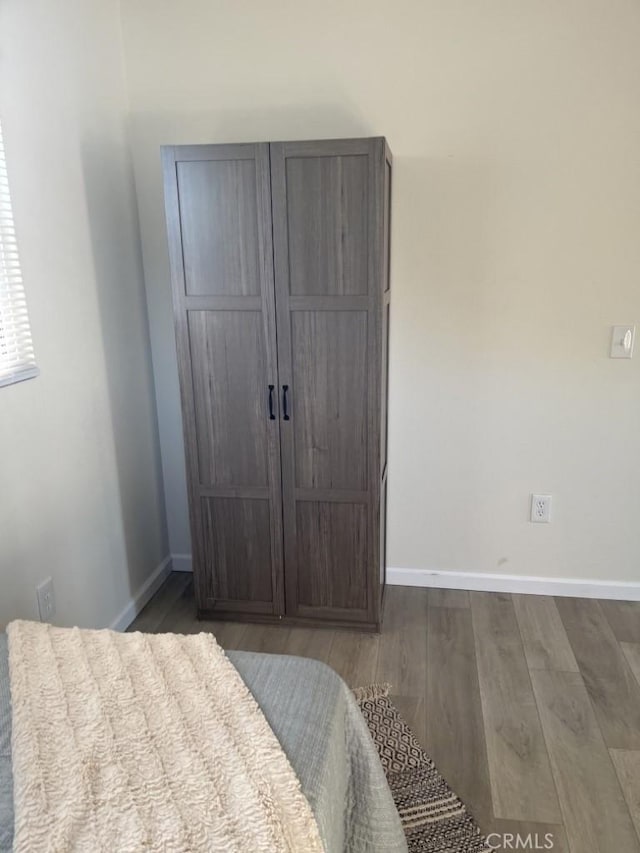 bedroom featuring dark hardwood / wood-style flooring