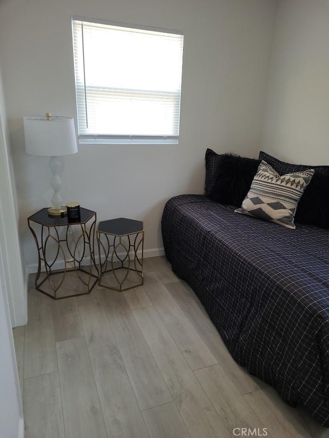 bedroom featuring light wood-type flooring