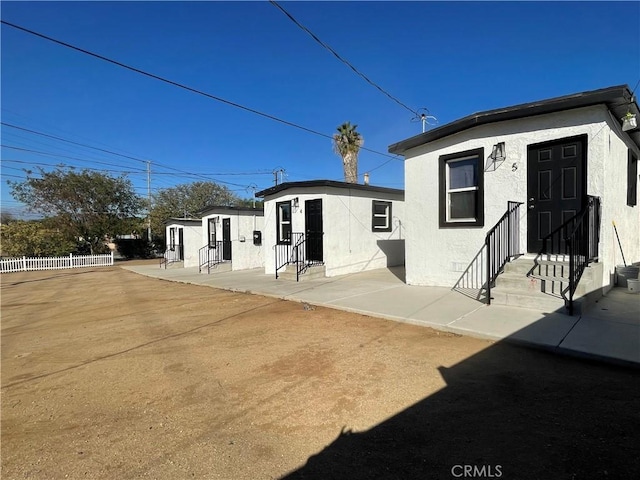 back of property featuring a patio area