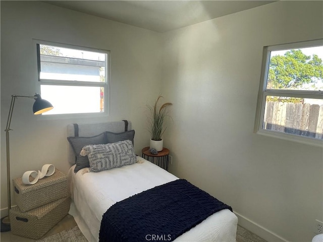 bedroom with multiple windows