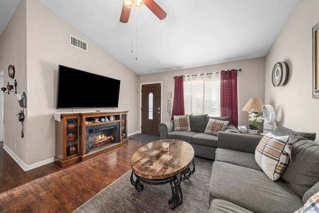 living room featuring ceiling fan, dark hardwood / wood-style flooring, and lofted ceiling