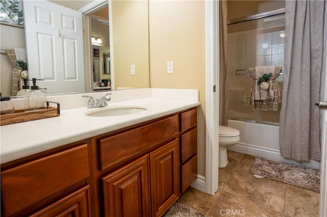 full bathroom with vanity, toilet, and tiled shower / bath