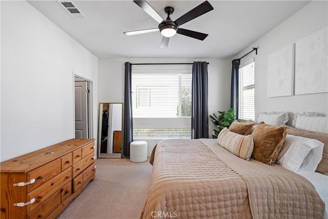 carpeted bedroom with ceiling fan