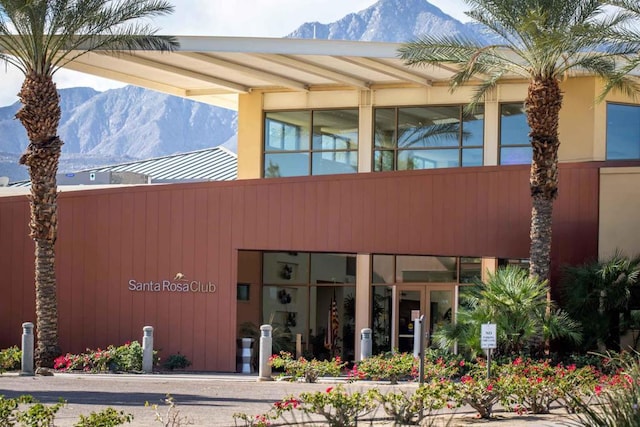 view of building exterior featuring a mountain view