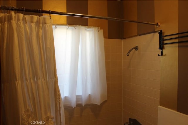 bathroom featuring shower / bath combination with curtain