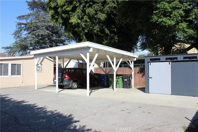 view of parking / parking lot with a carport