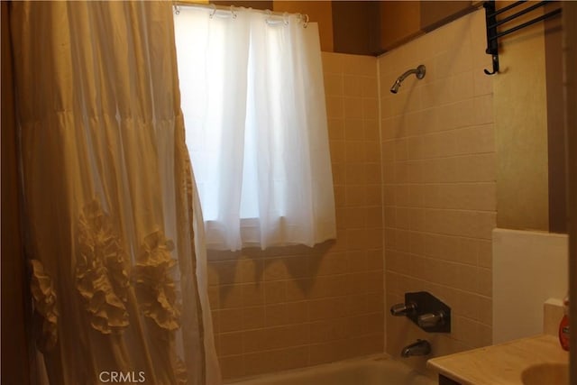 bathroom featuring shower / bath combo with shower curtain