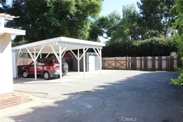 view of vehicle parking with a carport