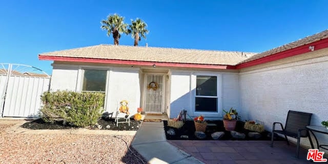 view of front of house with a patio area