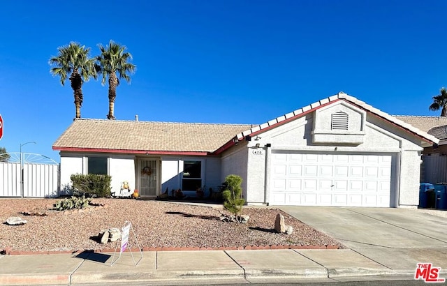 ranch-style home featuring a garage