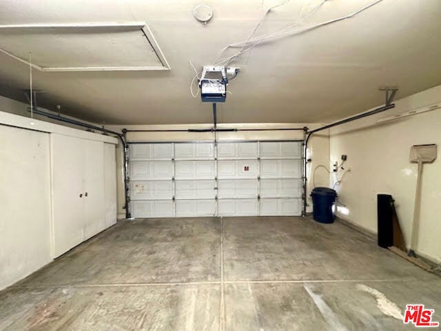 garage featuring a garage door opener