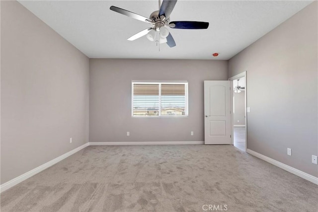 unfurnished bedroom with light colored carpet and ceiling fan