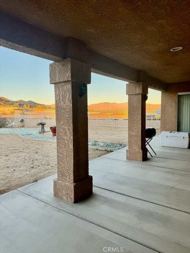 patio terrace at dusk with a mountain view