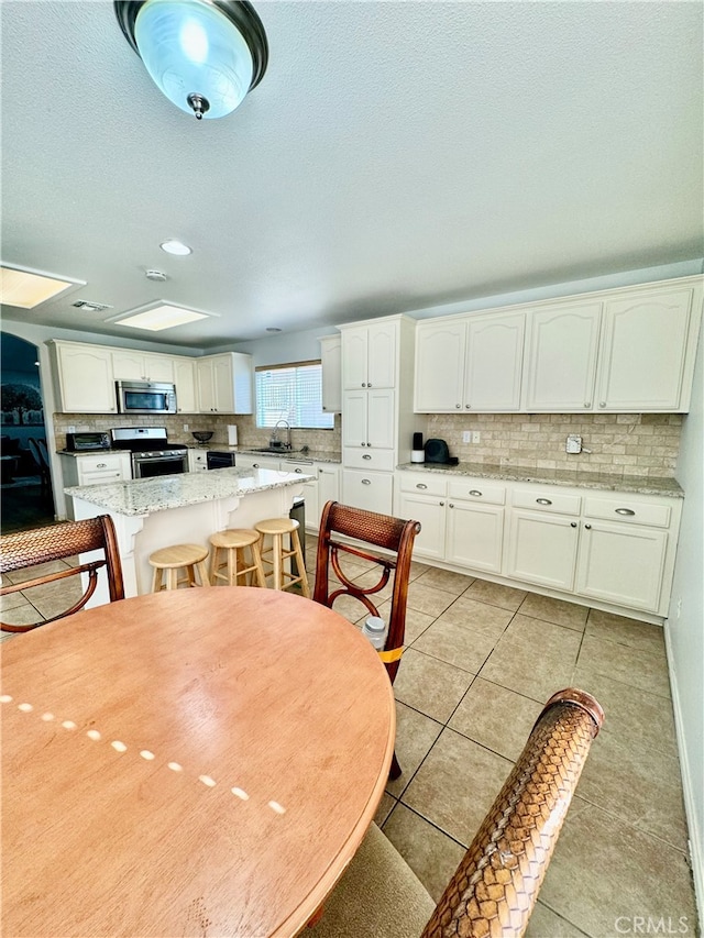 tiled dining space with sink