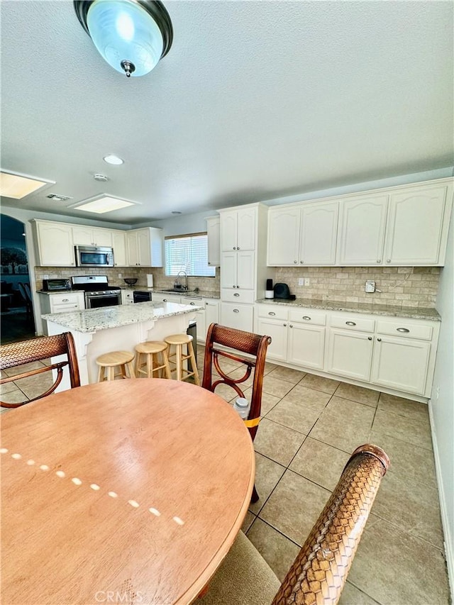 dining room with light tile patterned floors