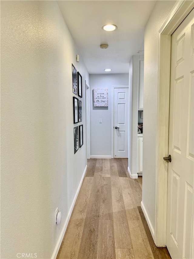 hallway featuring light hardwood / wood-style flooring