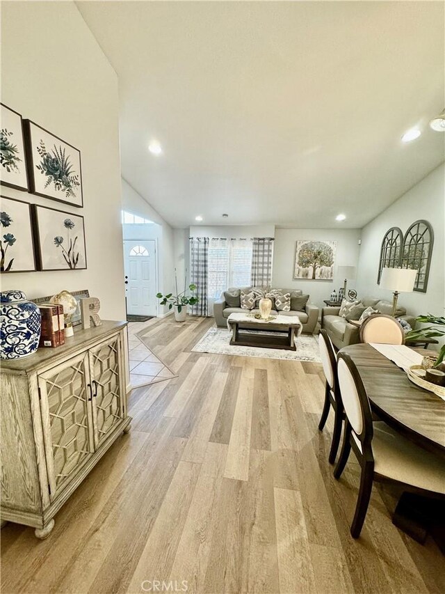 living room with recessed lighting and light wood-style floors