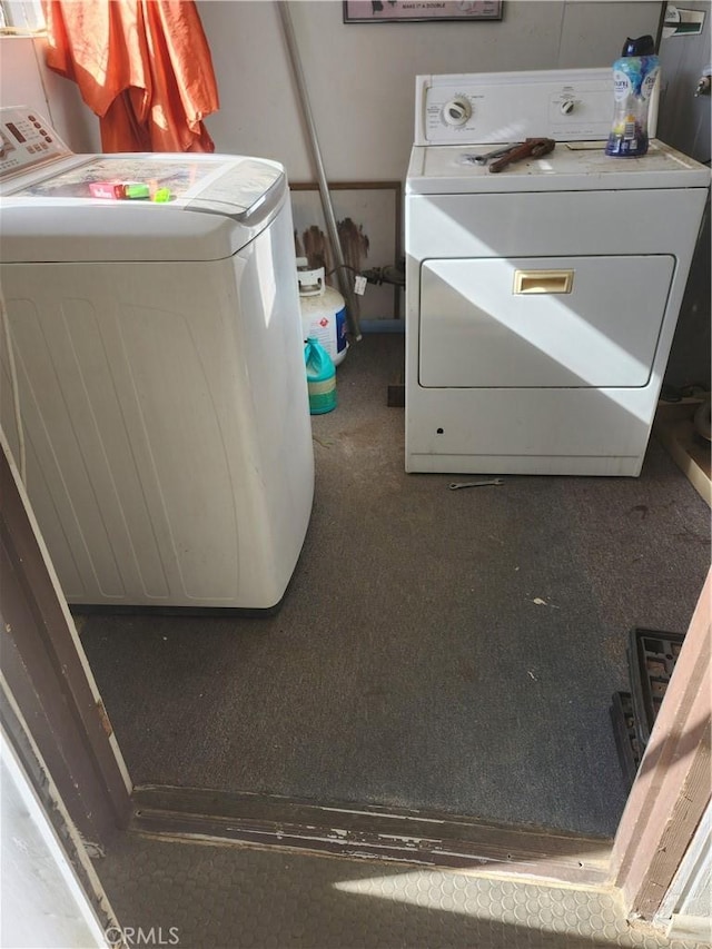 laundry area featuring washing machine and clothes dryer