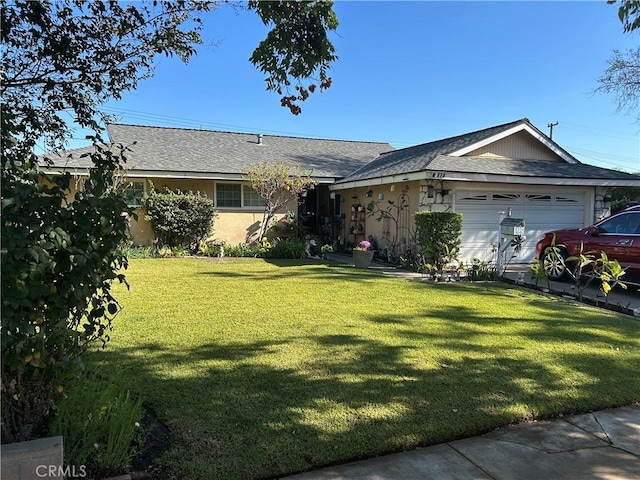 single story home with a front lawn and a garage