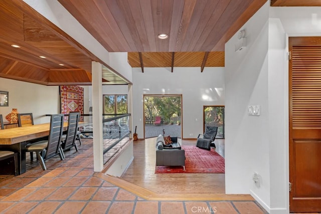 tiled living room featuring wood ceiling and beamed ceiling