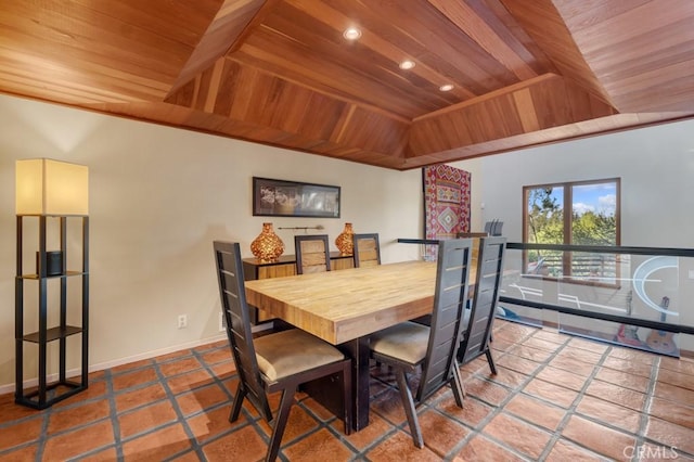 tiled dining space featuring a raised ceiling, vaulted ceiling, and wood ceiling