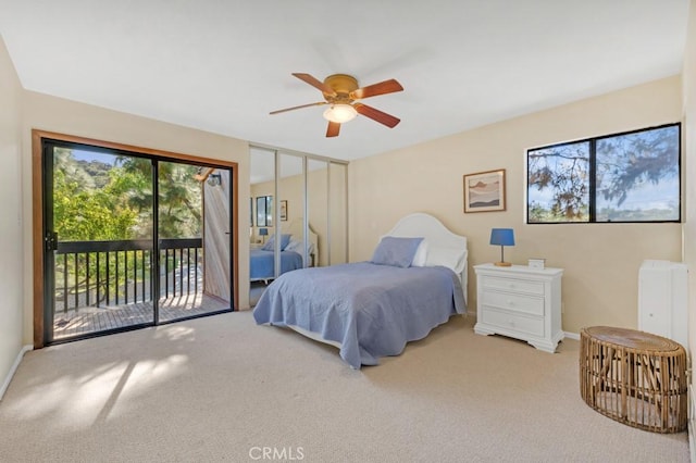 bedroom with light carpet, access to outside, and ceiling fan