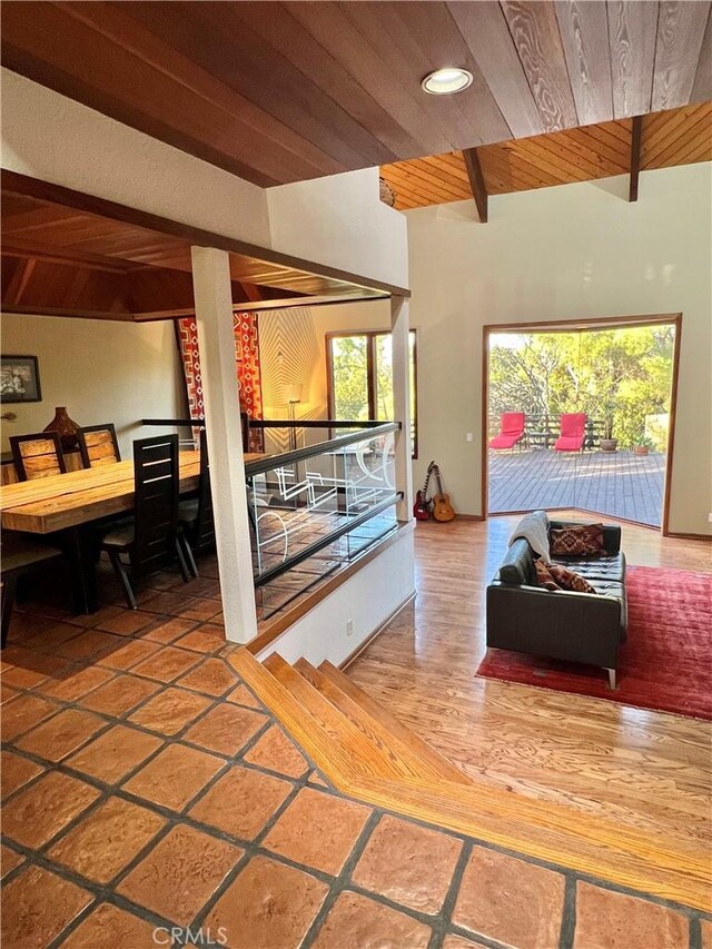 living room featuring wooden ceiling and lofted ceiling